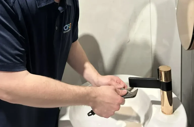 Matthew O'Sullivan fixing faucet